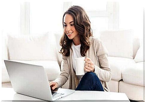 Smiling woman at computer