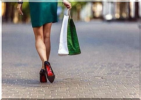 Woman with shopping bag is addicted to shopping