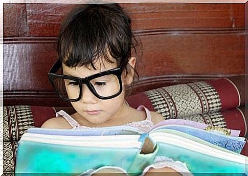 Little girl reading a book