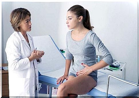 Gynecologist examines for muscle knots in the abdomen