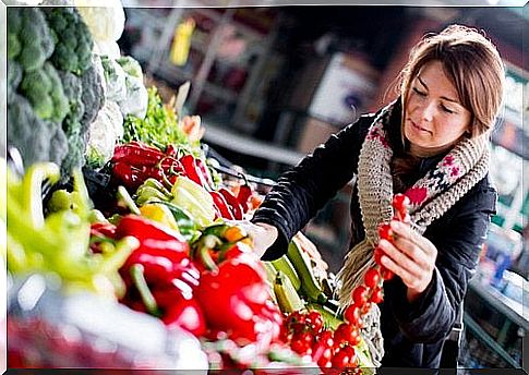 Woman buying vegetables