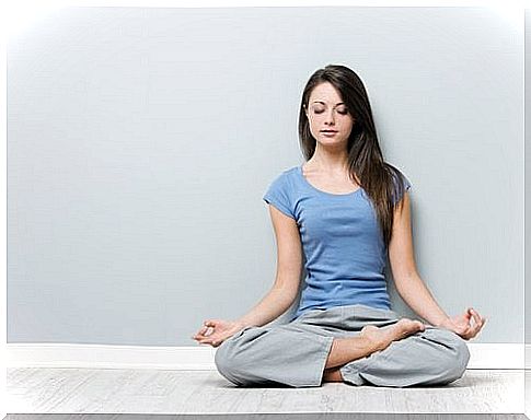 Woman sitting in lotus position