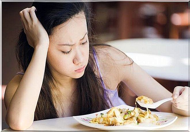 Woman looking at her food