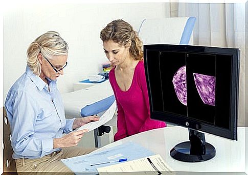 Woman is at the doctor's looking at a mammogram