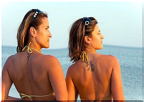 Two women in bikinis in the sun