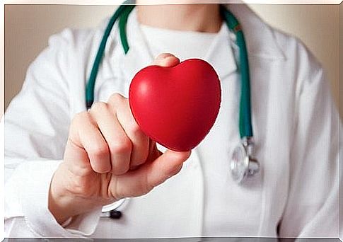 Doctor holding heart shape