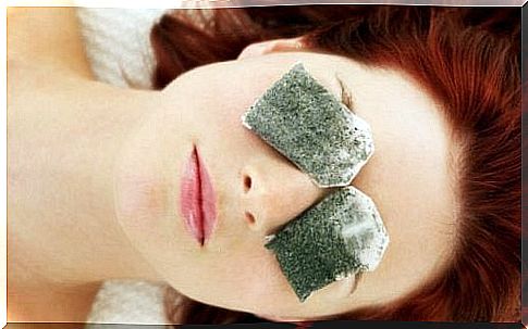 Woman with tea bags on her eyes