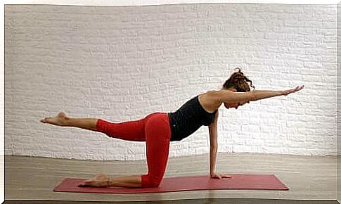 Woman doing exercise to strengthen the spine