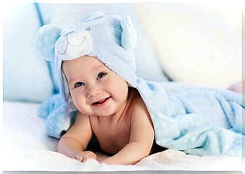 Baby lies wrapped in towel