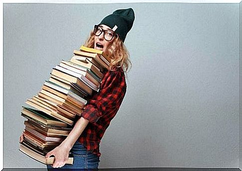 Woman with huge stack of books