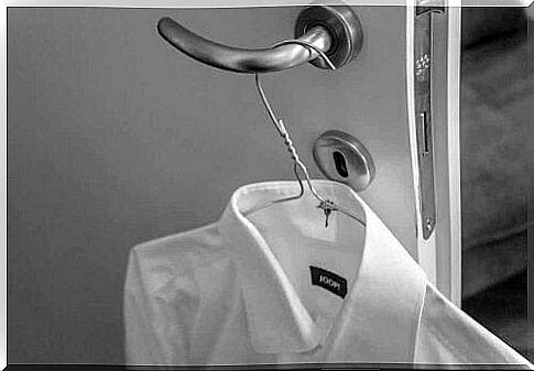 A shirt hangs on door handles