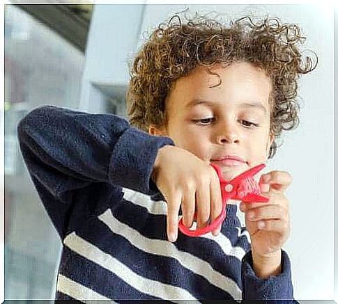 Boy with scissors