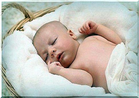 Baby sleeps peacefully in a basket