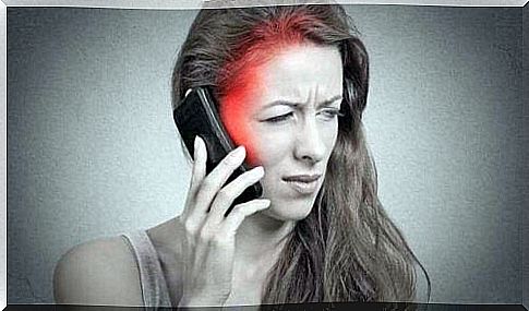 Woman getting headache from talking on the phone