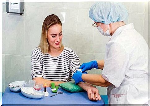 A woman gets a blood sample taken