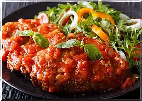 Meat with marinade and salad