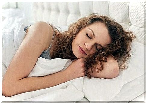 Woman lying and sleeping in her bed