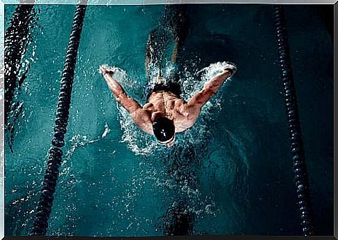 Man swimming in swimming pool