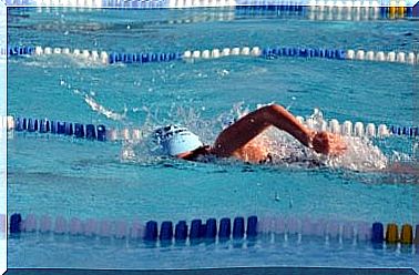 Person in the process of swimming in pool before choosing to swim in open sea