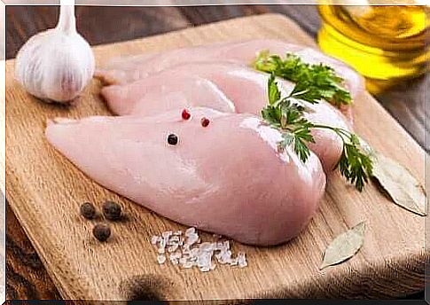 Chicken fillets on cutting board