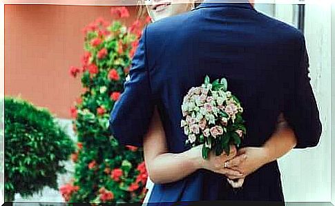 Hug with bridal bouquet